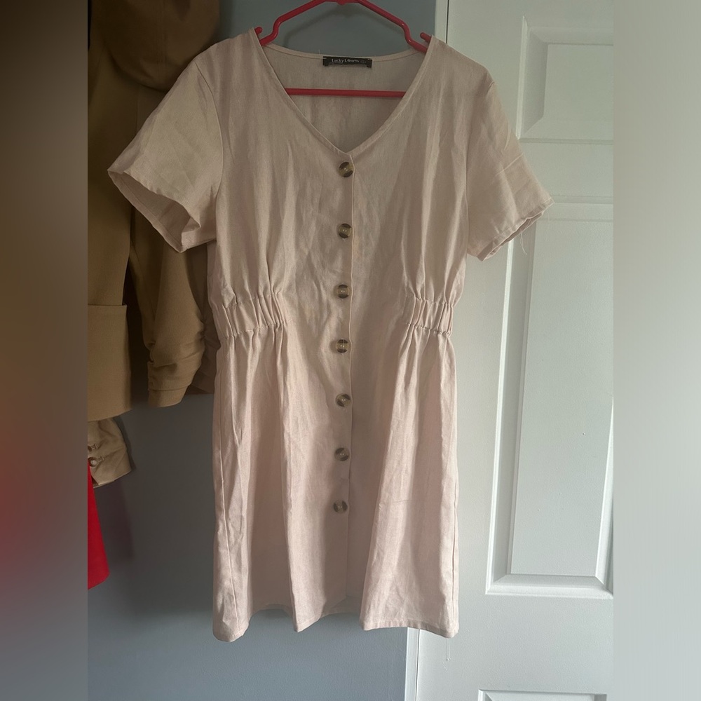 Light pink button down sun dress dress. Never been worn - only tried on.